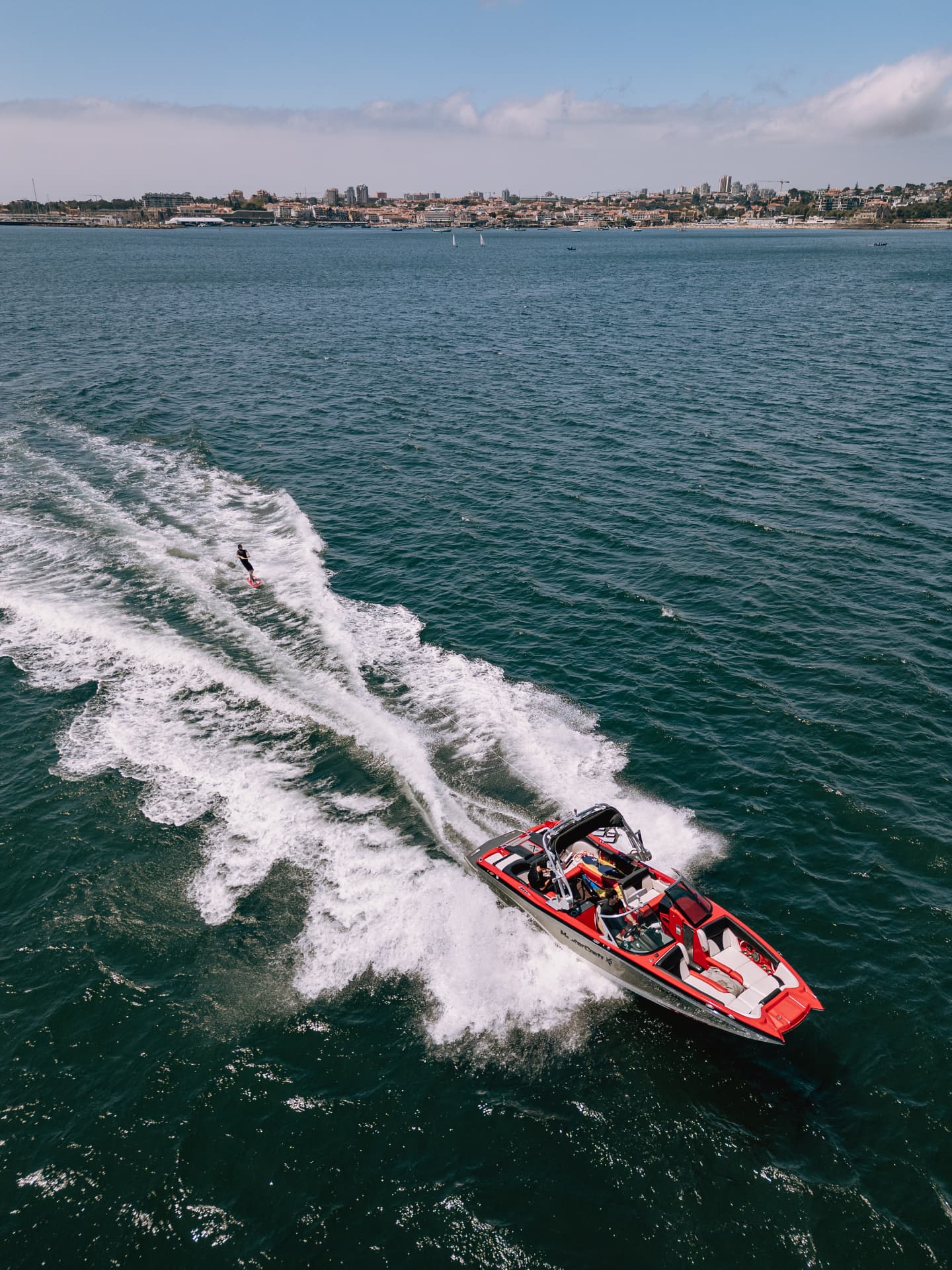 Wakeboarder towed by the club boat on the Atlantic near Estoril